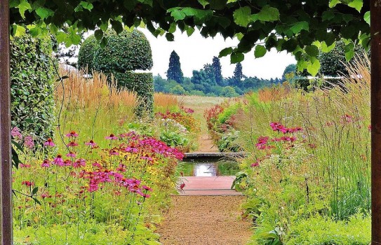Walled garden with prairie plantings and water rill at Broughton Grange Garden Walled garden with prairie plantings and water rill at Broughton Grange Garden